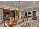Spacious dining room showcasing an open layout, stylish lighting, and a seamless connection to the outdoors at 748 Puerto Real Ct, Las Vegas, NV 89138