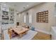 This dining room has a large wood table, a decorative hutch and shelving at 748 Puerto Real Ct, Las Vegas, NV 89138