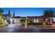 Charming single story home featuring a tile roof, landscaped yard, and two-car garage at 748 Puerto Real Ct, Las Vegas, NV 89138