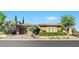 Charming single-story home with manicured landscaping, brick driveway, and inviting curb appeal at 748 Puerto Real Ct, Las Vegas, NV 89138
