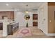 Inviting foyer featuring hardwood floors, elegant lighting, and convenient access to the living spaces and front door at 748 Puerto Real Ct, Las Vegas, NV 89138