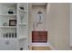 This hallway area has built-in shelving, a sink and counter, and neutral decor at 748 Puerto Real Ct, Las Vegas, NV 89138