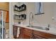 This hallway area features a sink and counter, decor shelving and storage at 748 Puerto Real Ct, Las Vegas, NV 89138