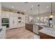 Bright, modern kitchen with granite countertops, stainless steel appliances, and ample cabinet space at 748 Puerto Real Ct, Las Vegas, NV 89138