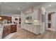 Spacious kitchen featuring stainless appliances, gas cooktop, white cabinets, and large center island at 748 Puerto Real Ct, Las Vegas, NV 89138