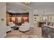 Bright living room featuring comfortable seating, built-in shelves, and open access to the kitchen area at 748 Puerto Real Ct, Las Vegas, NV 89138