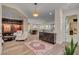 Spacious open-concept room with living room, bar, and seating area, perfect for entertaining and Gathering gatherings at 748 Puerto Real Ct, Las Vegas, NV 89138