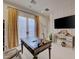 This office has a decorative desk, a modern workstation and gold colored accents at 748 Puerto Real Ct, Las Vegas, NV 89138