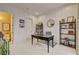 This office has white paneling, modern shelving, and a decorative desk and chair at 748 Puerto Real Ct, Las Vegas, NV 89138