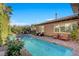 Sparkling pool featuring a spa and an elongated design perfect for exercise and relaxation at 748 Puerto Real Ct, Las Vegas, NV 89138