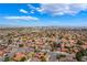 View of the Las Vegas skyline from a quiet neighborhood with single Gathering homes at 8000 Vista Twilight Dr, Las Vegas, NV 89123