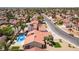 Aerial view of a house with a private pool and landscaping in a neighborhood at 8000 Vista Twilight Dr, Las Vegas, NV 89123