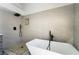 Elegant bathroom featuring a freestanding tub, modern fixtures, and a spacious tiled shower at 8000 Vista Twilight Dr, Las Vegas, NV 89123