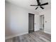 Bedroom featuring hardwood floors, a ceiling fan, and a closet with sliding doors at 8000 Vista Twilight Dr, Las Vegas, NV 89123