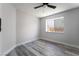 Empty bedroom featuring wood floors, neutral walls, a ceiling fan, and natural light at 8000 Vista Twilight Dr, Las Vegas, NV 89123