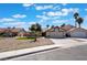 Charming single-story home featuring a well-maintained gravel yard, mature trees and an attached two-car garage at 8000 Vista Twilight Dr, Las Vegas, NV 89123