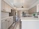 Bright kitchen featuring stainless steel appliances, white countertops, sleek cabinets and modern light fixtures at 8000 Vista Twilight Dr, Las Vegas, NV 89123