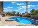 Backyard featuring a pool with an attached jacuzzi, a patio, and palm trees at 8000 Vista Twilight Dr, Las Vegas, NV 89123