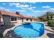 Backyard featuring a pool with an attached jacuzzi, a patio, and an orange tile roof at 8000 Vista Twilight Dr, Las Vegas, NV 89123