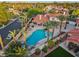 Aerial view of a home with a pool, mature landscaping, and an outdoor seating area at 8104 Wispy Sage Way, Las Vegas, NV 89149