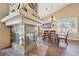 Elegant dining room showcasing a marble fireplace and ample natural light at 8104 Wispy Sage Way, Las Vegas, NV 89149