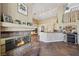 Inviting living area featuring a cozy fireplace and open layout to the kitchen at 8104 Wispy Sage Way, Las Vegas, NV 89149