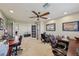 This spacious office includes dual workstations and has a ceiling fan at 8104 Wispy Sage Way, Las Vegas, NV 89149