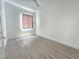 Bedroom featuring hardwood flooring and a window with shades at 8545 Summer Vista Ave, Las Vegas, NV 89145
