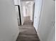 Hallway with wood-look flooring and leading to other rooms in the house at 8545 Summer Vista Ave, Las Vegas, NV 89145