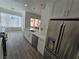 Modern kitchen with white cabinets, stainless steel appliances, and plenty of counter space at 8545 Summer Vista Ave, Las Vegas, NV 89145