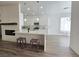 Modern kitchen with white cabinetry, stainless steel appliances, and a breakfast bar with seating at 8545 Summer Vista Ave, Las Vegas, NV 89145