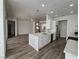 Spacious kitchen with an island, stainless steel appliances, and open layout at 8545 Summer Vista Ave, Las Vegas, NV 89145