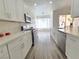 Bright kitchen with stainless steel appliances, ample counter space, and a view to the outside at 8545 Summer Vista Ave, Las Vegas, NV 89145