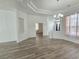 Open-concept living area with natural light, modern floors and a view to other rooms at 8545 Summer Vista Ave, Las Vegas, NV 89145