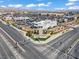 An aerial view displays Skye Canyon's entrance, roads, nearby shops, and community design at 9543 Havasu Canyon Ave, Las Vegas, NV 89166