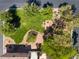 Lush landscaping surrounds the house; a bird's eye view highlights greenery and design at 9543 Havasu Canyon Ave, Las Vegas, NV 89166