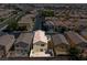 Aerial view of the property showcasing the house and surrounding neighborhood, with a private patio at 9543 Havasu Canyon Ave, Las Vegas, NV 89166