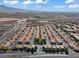 Aerial view shows the community's layout with rows of houses stretching toward distant mountains at 9543 Havasu Canyon Ave, Las Vegas, NV 89166