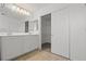 Bright bathroom featuring double sinks, walk-in closet and tile floors at 9543 Havasu Canyon Ave, Las Vegas, NV 89166