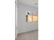 Cozy bedroom view featuring carpet flooring and a window overlooking the outdoors at 9543 Havasu Canyon Ave, Las Vegas, NV 89166