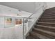 Open-concept living area featuring a staircase, tile flooring, and backyard access at 9543 Havasu Canyon Ave, Las Vegas, NV 89166