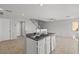 Open-concept living area featuring tile flooring, a breakfast bar, and access to the upstairs at 9543 Havasu Canyon Ave, Las Vegas, NV 89166
