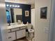 Stylish bathroom showcasing modern fixtures, unique wallpaper, and ample vanity space at , Las Vegas, NV 89183