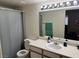 Well-lit bathroom featuring a shower-tub combo, vanity, and a large mirror at , Las Vegas, NV 89183