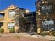 Exterior view of a two-story apartment building with desert landscaping and ample parking at , Las Vegas, NV 89183