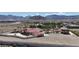 Expansive estate with a terracotta roof, private pool, and mountain views in a desert setting at 10280 W La Mancha Ave, Las Vegas, NV 89149
