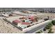 Expansive home with red tile roof, sparkling pool, and large landscaped yard in a desert landscape at 10280 W La Mancha Ave, Las Vegas, NV 89149
