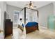 Bedroom with a 4 poster bed, canopy, fan, and bright natural light at 10280 W La Mancha Ave, Las Vegas, NV 89149