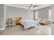 Neutral colored bedroom featuring a platform bed, desk, and sitting chairs at 10280 W La Mancha Ave, Las Vegas, NV 89149