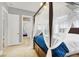 Bedroom featuring a canopy bed, bright natural light, and a view into the next room at 10280 W La Mancha Ave, Las Vegas, NV 89149